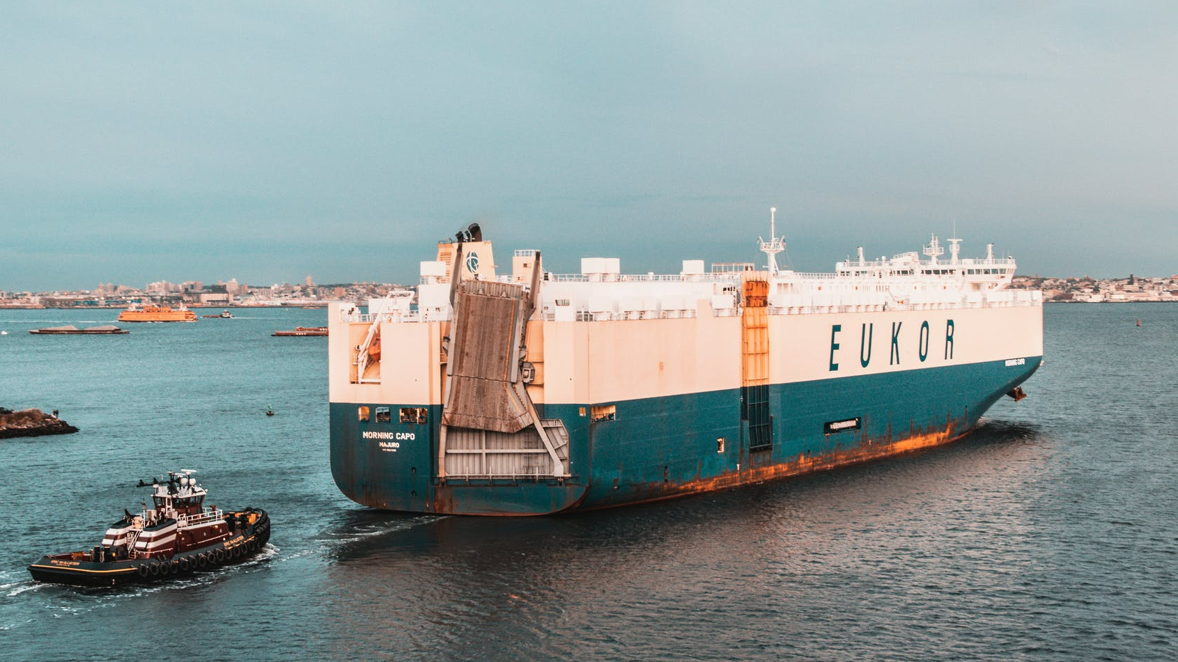 white and green cruise ship on sea