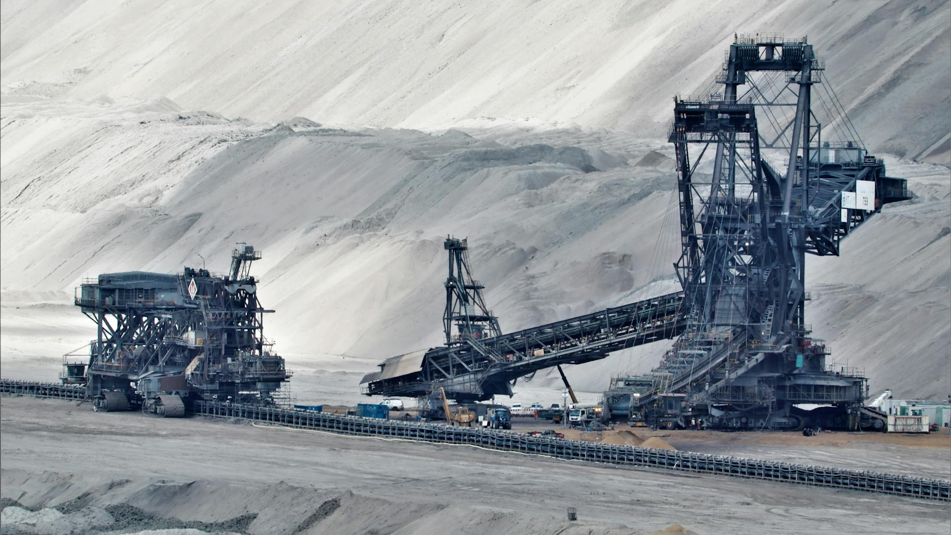 a bucket wheel excavator in a coal mine in grayscale photography